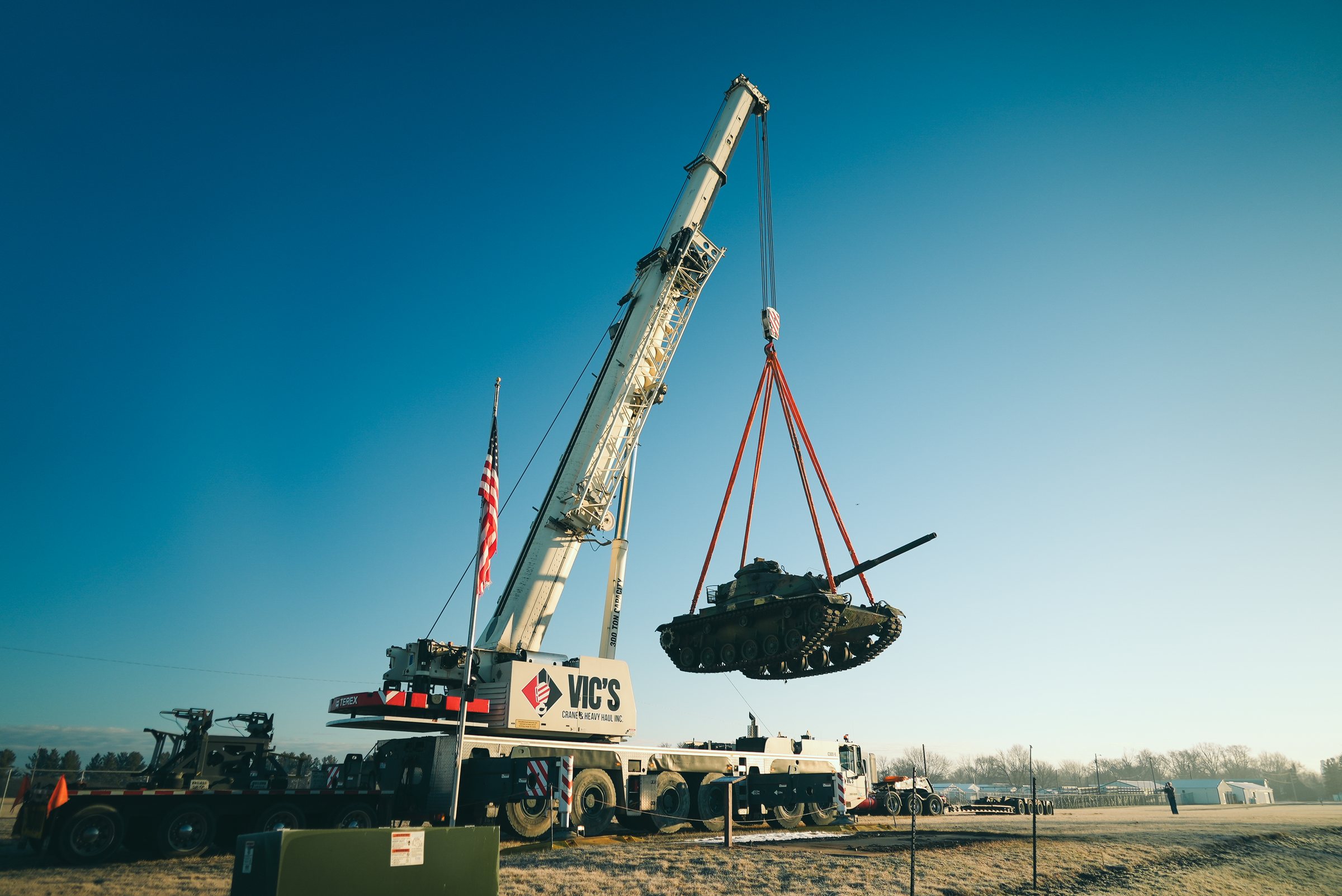 Construction videography: crane lifting a load on a job site